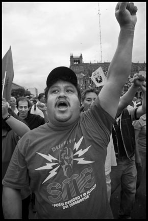 An electrical worker protests his firing.